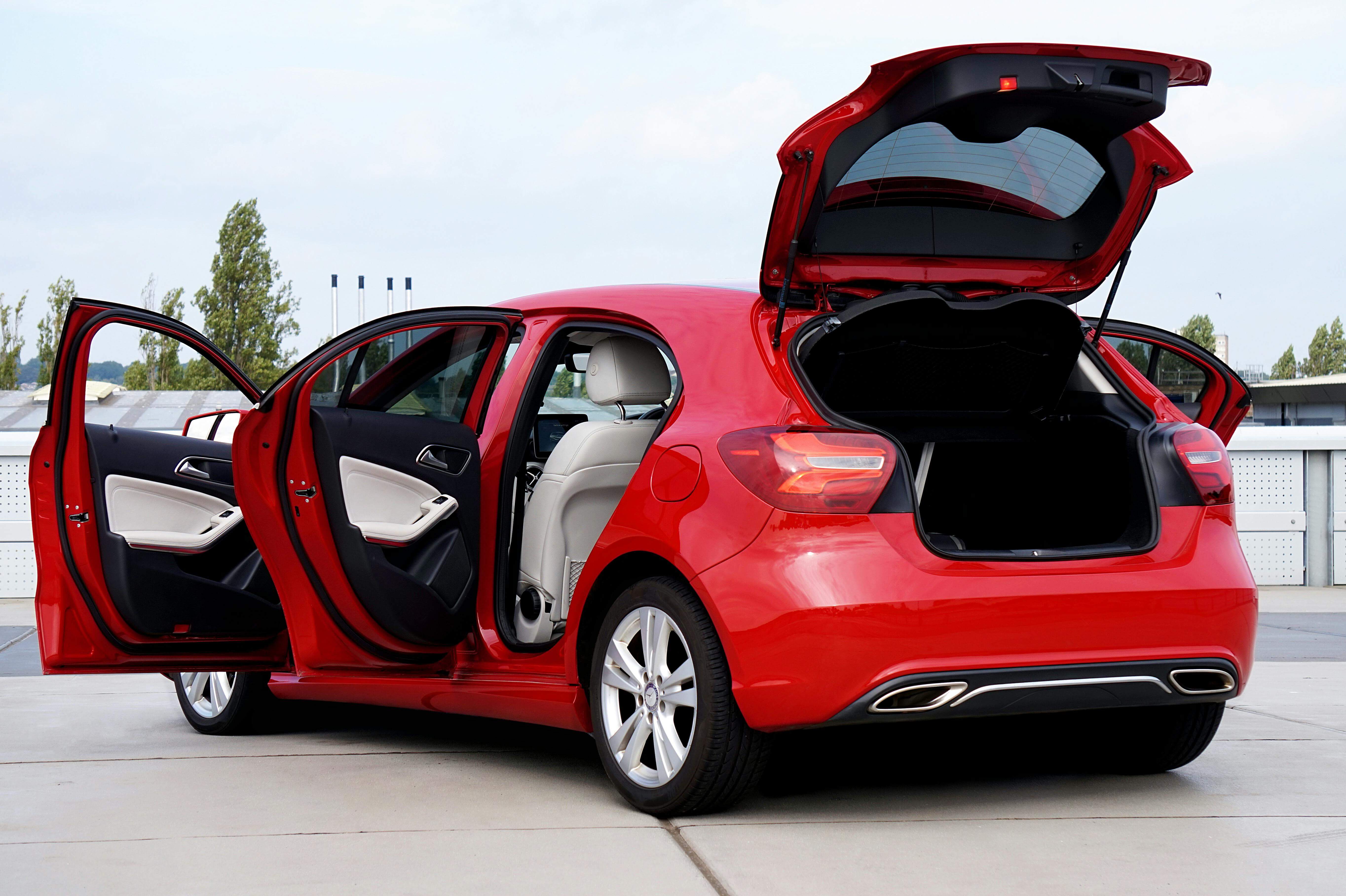 A car with its trunk and doors open